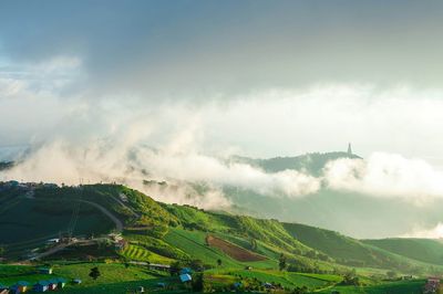 Scenic view of landscape against cloudy sky