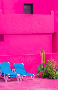Fashion tropical minimal location. pink hotel wall, swimming pool area canary islands. 