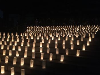 Row of illuminated lights at night