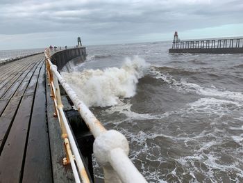 Panoramic view of pier over sea against sky