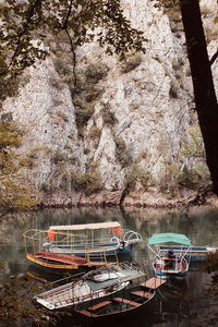 Boats moored on rock by lake - matka canyon