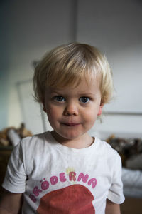 Portrait of blonde boy in dirty t-shirt