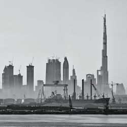 City skyline with burj khalifa against clear sky