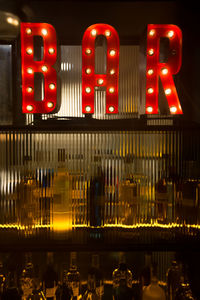 View of illuminated sign at night