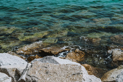 High angle view of rocks in sea