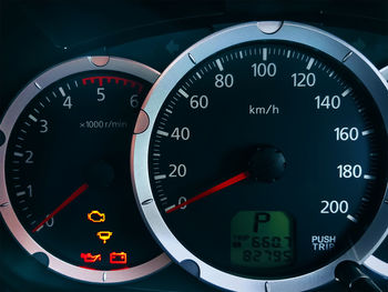 Close-up car console with metric unit system speedometer