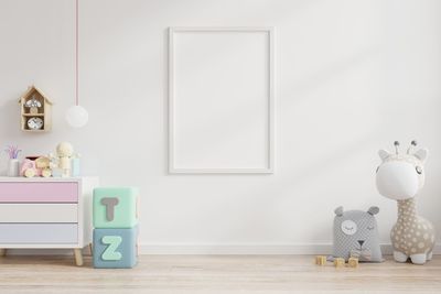 Picture frame on wall with toys at home