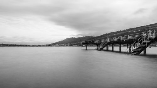 Bridge over bay against sky