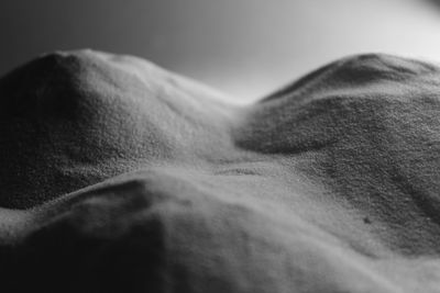 Sand dunes at desert against clear sky