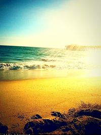 Scenic view of beach against clear sky