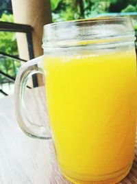 Close-up of yellow drink on table