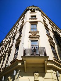 Low angle view of building against clear blue sky