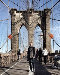 Tourists walking on bridge