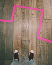 Low section of man standing on floor