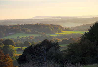 Scenic view of landscape against sky at sunset