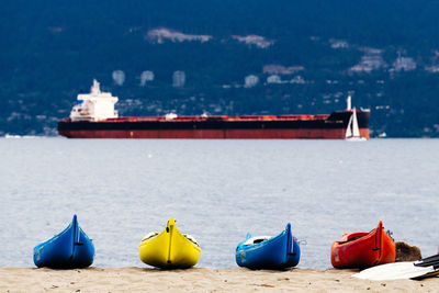 Boats moored on sea shore