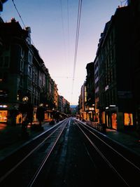 View of railroad tracks amidst buildings in city