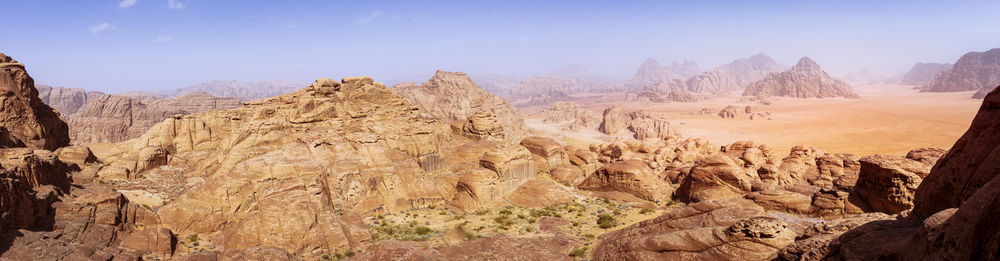 Vivid and colorful panorama of the wadi rum desert in jordan as seen from burdah rock mountain. 