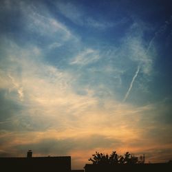 Low angle view of cloudy sky at sunset