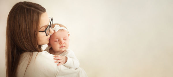 Banner love mother and child, tenderness, parenthood and upbringing, woman and newborn girl