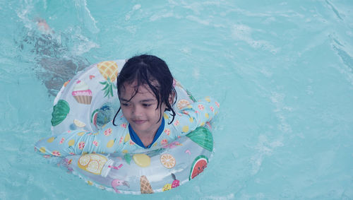 Young woman swimming in sea