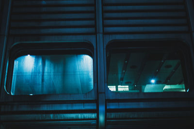 Low angle view of illuminated train windows