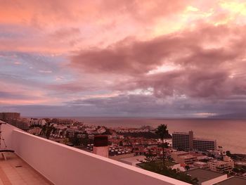 High angle view of buildings against sky during sunset