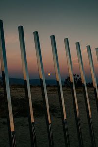 Metal fence against sky