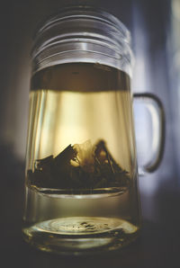 Close-up of drink in glass jar on table