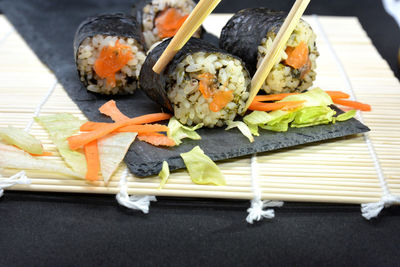 Close-up of sushi served on table