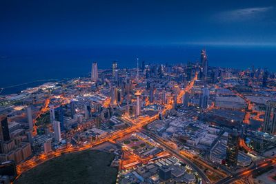 High angle view of illuminated buildings in city at night