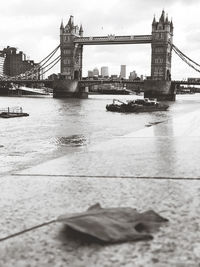 Bridge over river with city in background