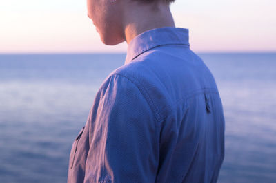 Close-up of woman against sea