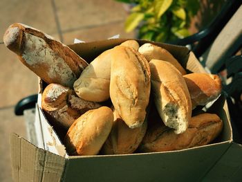 High angle view of bread in paper bag on table