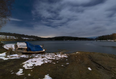 Landscape of half frozen vlasina lake in cold winter night. long exposure photo.