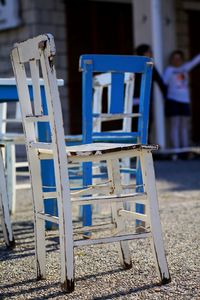 Wooden chairs on sidewalk cafe