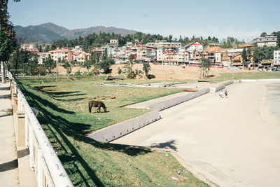 High angle view of townscape by road in city