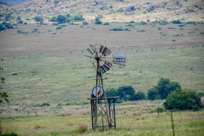 Traditional windmill on field