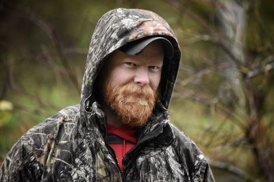 Portrait of young man in forest