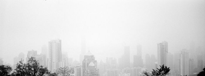 Modern buildings in city against sky
