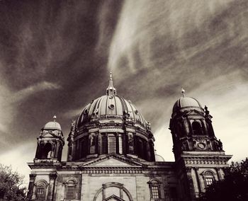 Low angle view of church against cloudy sky