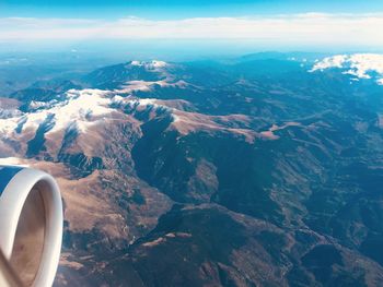 Aerial view of mountains against sky