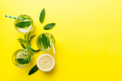 Directly above shot of fruits on yellow background