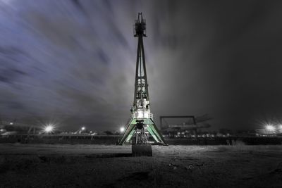 Illuminated building against sky at night