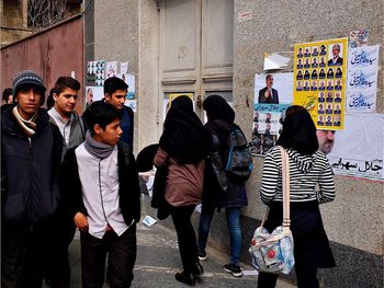 Woman standing on wall