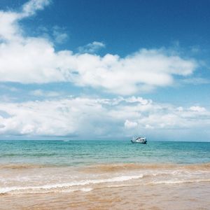 Scenic view of sea against cloudy sky