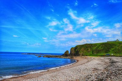 Scenic view of sea against blue sky