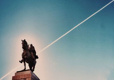 Low angle view of statue against sky