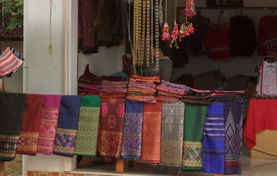 Multi colored clothes hanging at home