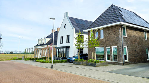 Buildings in city against sky